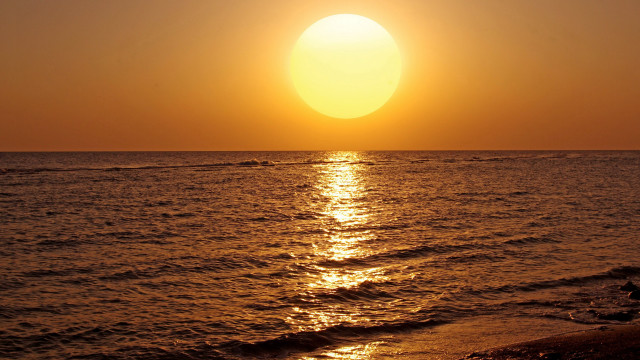 Sunset ocean surfer boat shore free wallpaper - medium preview image