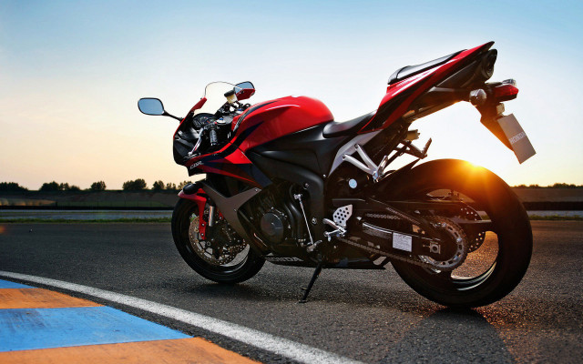 Red motorcycle sunset backlit photorealism free wallpaper - medium preview image