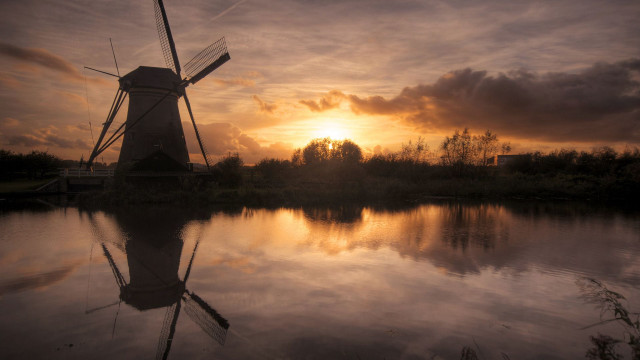 Windmill sunset water cityscape clouds free wallpaper - medium preview image