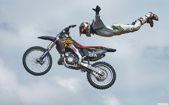 Man flying motorcycle helmet gloves free wallpaper - medium preview image
