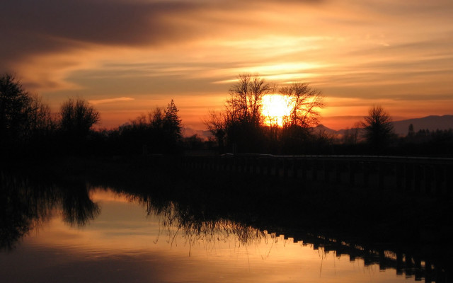 Sunset water trees fence clouds free wallpaper - medium preview image