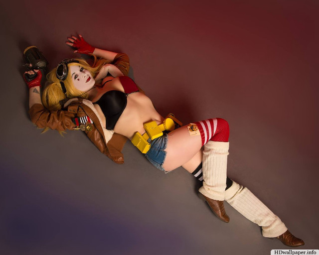 Woman costume laying ground toy free wallpaper - medium preview image