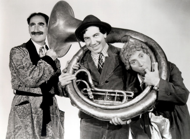 Men holding trumpet horn hats free wallpaper - medium preview image