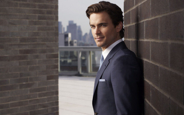 Man suit brick wall cityscape free wallpaper - medium preview image