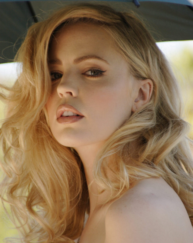 Woman blonde hair umbrella serious free wallpaper - medium preview image
