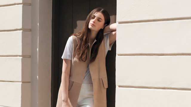 Woman looking window building hand free wallpaper - medium preview image