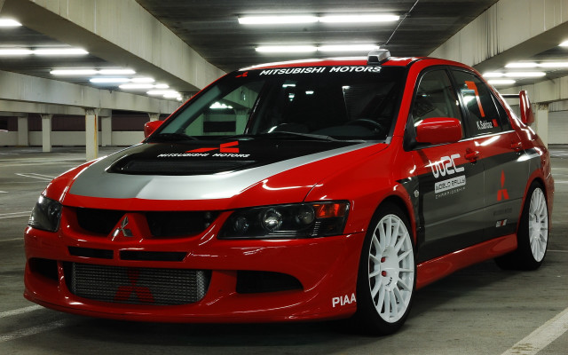 Red car parking garage white free wallpaper - medium preview image