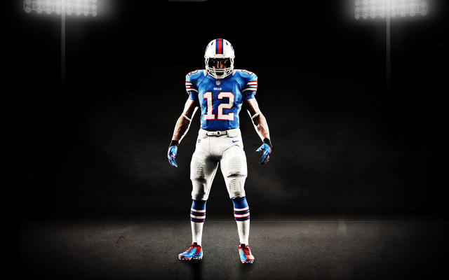 Football player blue uniform spotlight free wallpaper - medium preview image