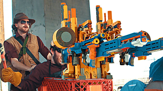 Man sitting toys gun hat free wallpaper - medium preview image