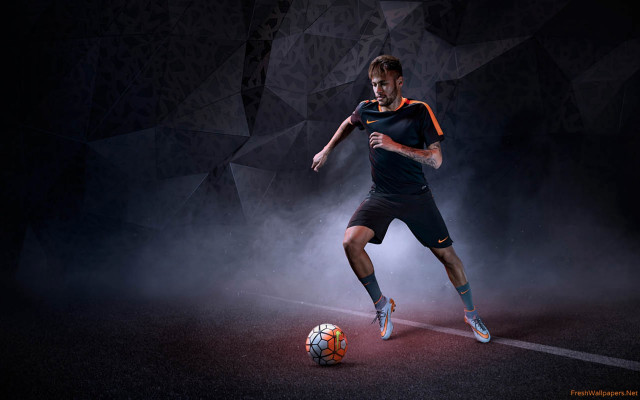 Man kicking soccer ball dark free wallpaper - medium preview image