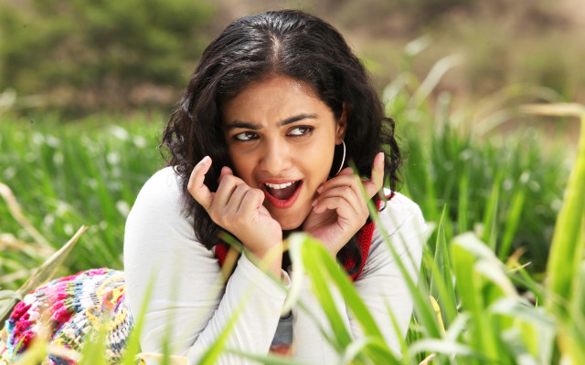 Woman laying grass hands face free wallpaper - medium preview image