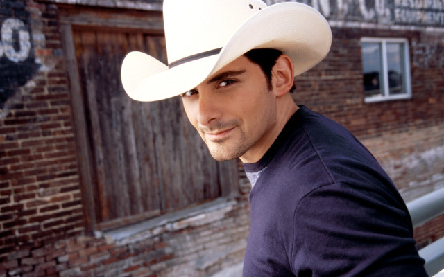 Man cowboy hat graffiti building free wallpaper - medium preview image