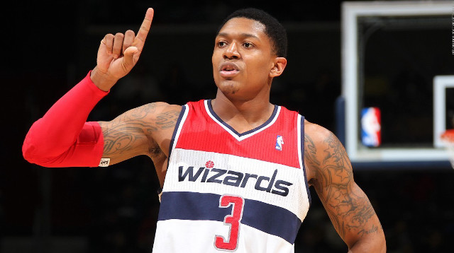 Man red jersey holding basketball free wallpaper - medium preview image