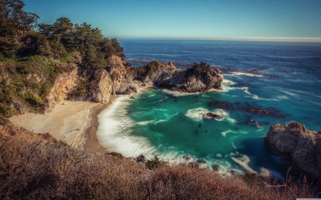 Beach water cliff trees blue free wallpaper - medium preview image