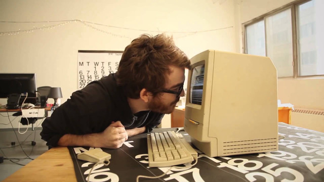 Man leaning computer keyboard mouse free wallpaper - medium preview image