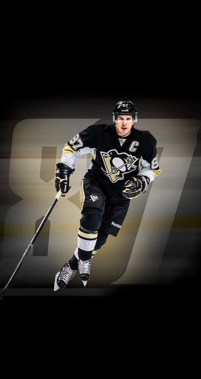 Hockey player running puck number free wallpaper - medium preview image
