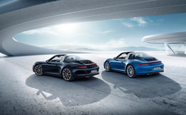 Two blue porsches building sky free wallpaper - medium preview image