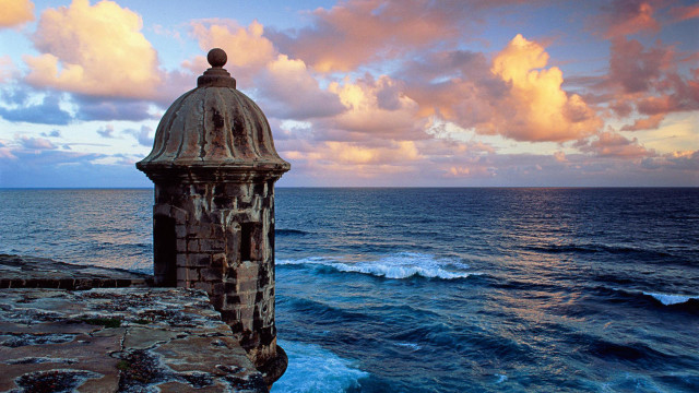 Tower cliff ocean sunset clouds free wallpaper - medium preview image