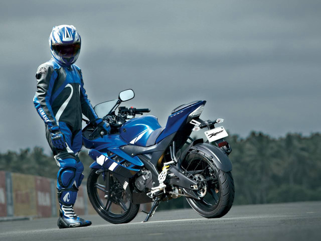 Man blue motorcycle suit helmet free wallpaper - medium preview image