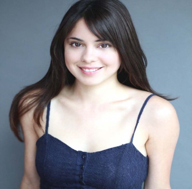 Woman blue top smiling gray free wallpaper - medium preview image