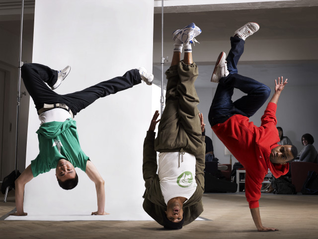 Three boys handstand white wall free wallpaper - medium preview image