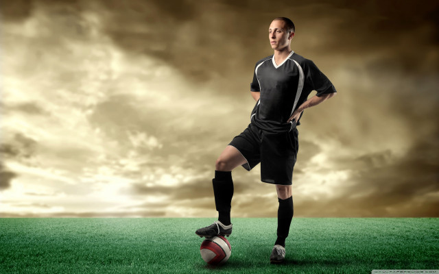 Man soccer uniform standing on free wallpaper - medium preview image