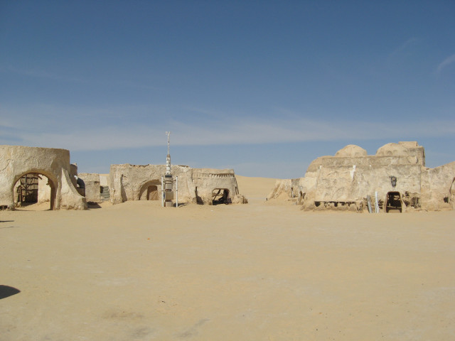 Desert buildings sky clouds people free wallpaper - medium preview image