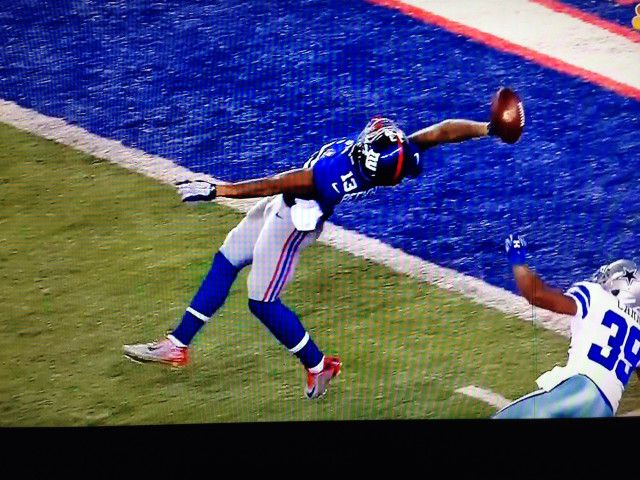 Football player catching ball air free wallpaper - medium preview image