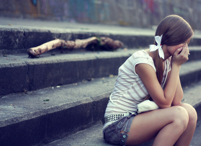 Girl sitting on steps crying free wallpaper - medium preview image
