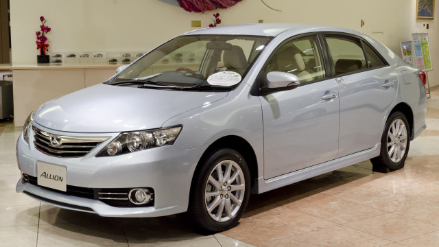 Silver car showroom red flowers free wallpaper - medium preview image