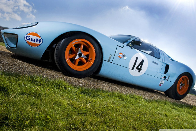 Blue racecar orange wheels dirtroad free wallpaper - medium preview image