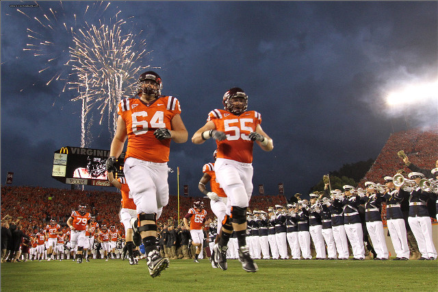 Football players running fireworks crowd free wallpaper - medium preview image