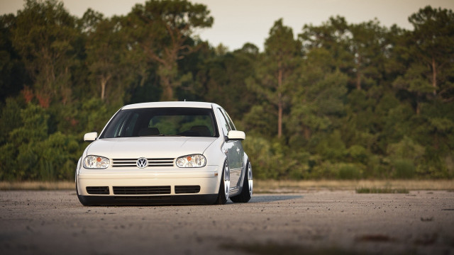 White car parked next to free wallpaper - medium preview image