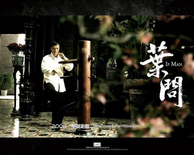 Man standing pillar flower arrangement free wallpaper - medium preview image