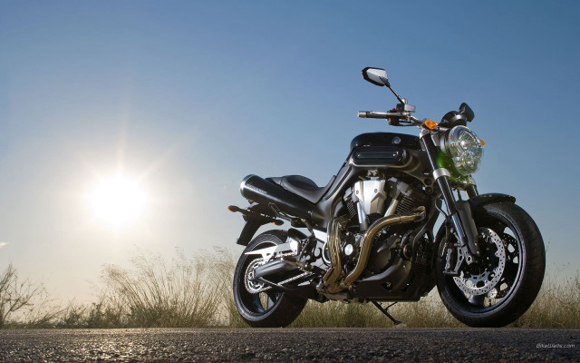 Motorcycle parked road sun sky free wallpaper - medium preview image