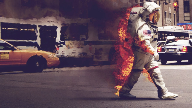 Man space suit fire building free wallpaper - medium preview image