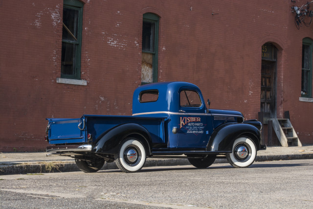 Blue truck parked road building free wallpaper - medium preview image