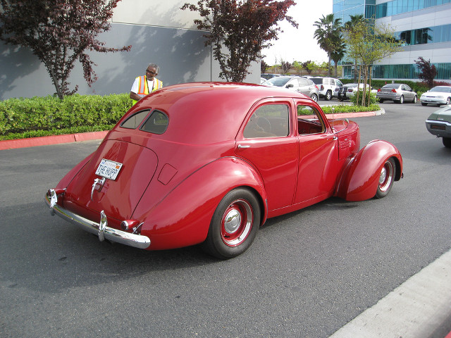 Red car parked road building #3 free wallpaper - medium preview image
