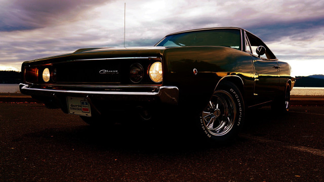 Black car parked road water free wallpaper - medium preview image