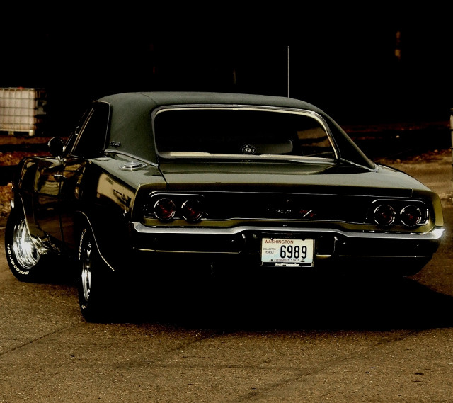 Green car parked dark road free wallpaper - medium preview image