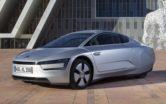 Silver car parked building statue free wallpaper - medium preview image