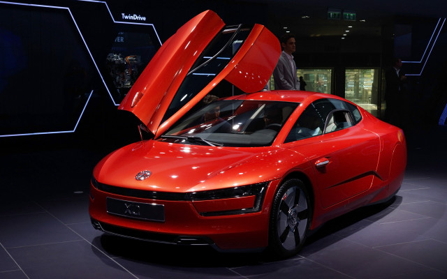 Red car hood open showroom free wallpaper - medium preview image