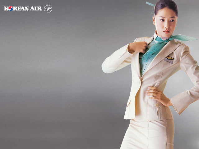 Woman suit tie posing hands free wallpaper - medium preview image