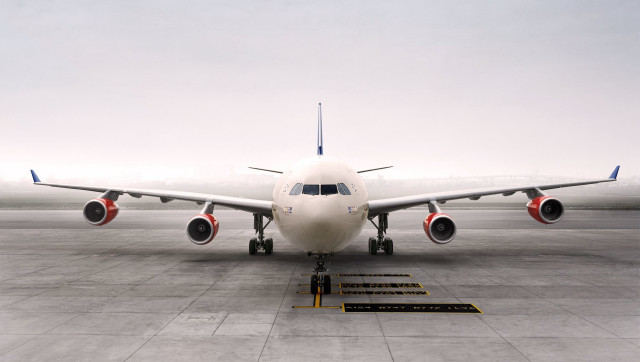 Jetliner airport tarmac sky background free wallpaper - medium preview image