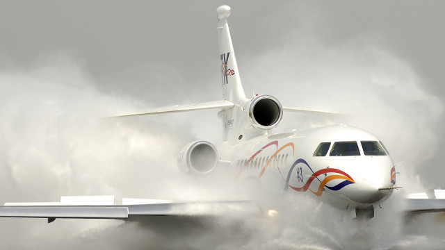 Jetliner cloudy sky runway smoke free wallpaper - medium preview image