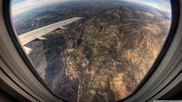 Mountain airplane window view ground free wallpaper - medium preview image
