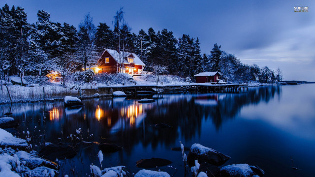 Snowy night lake house fireworks free wallpaper - medium preview image