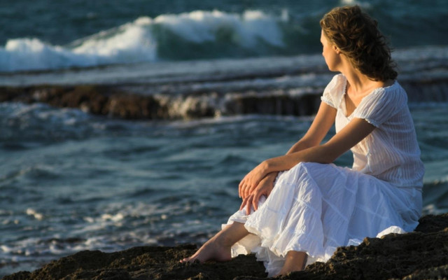 Woman sitting rock ocean waves #2 free wallpaper - medium preview image