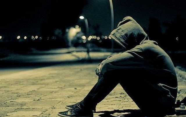 Person sitting head down street free wallpaper - medium preview image