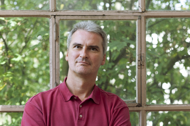 Man red shirt window trees free wallpaper - medium preview image